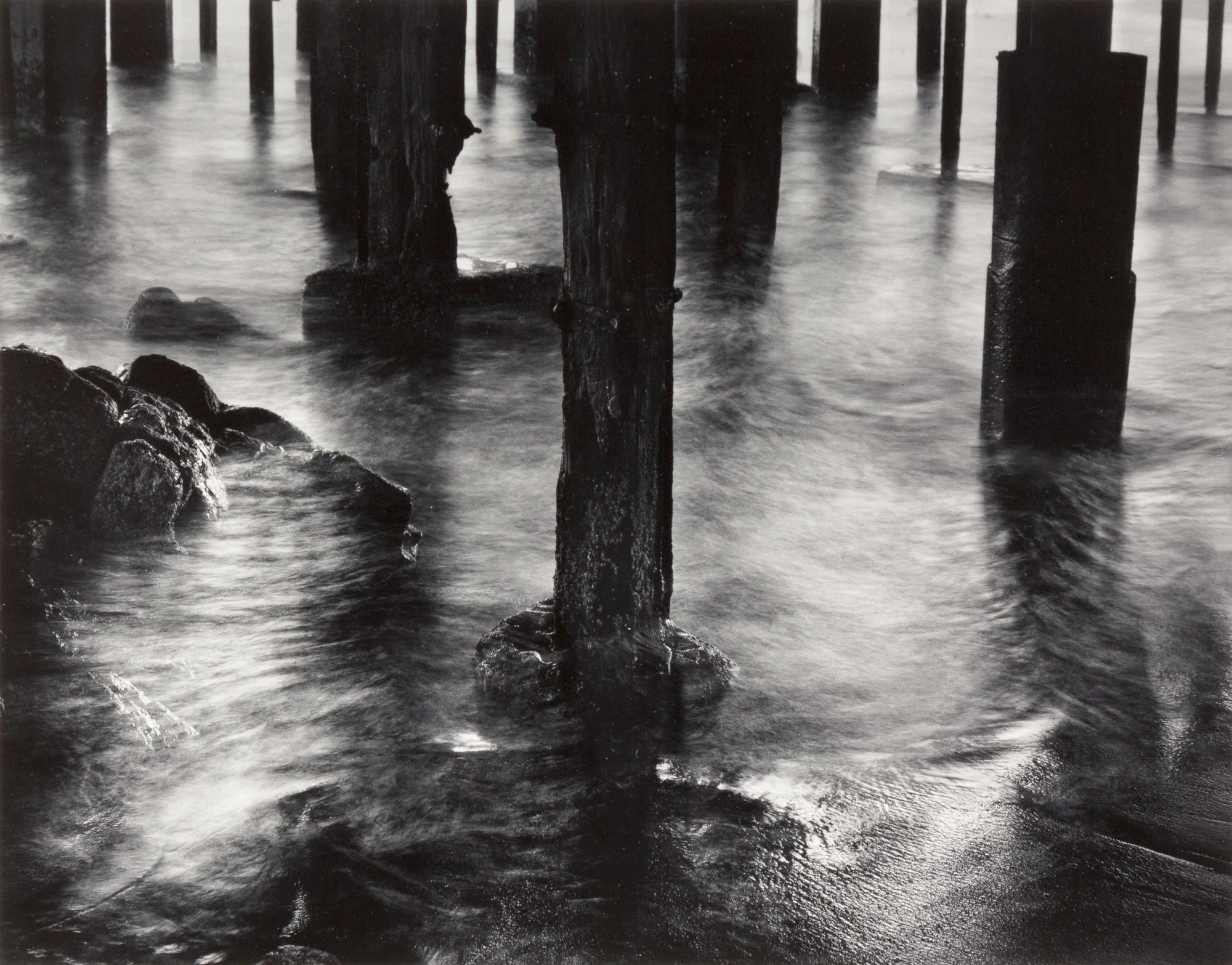 Wynn Bullock, (American, 1902-1975), Pilings under Cannery Row, 1958