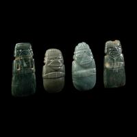 Four Costa Rican Jade Figural Celt Pendants
