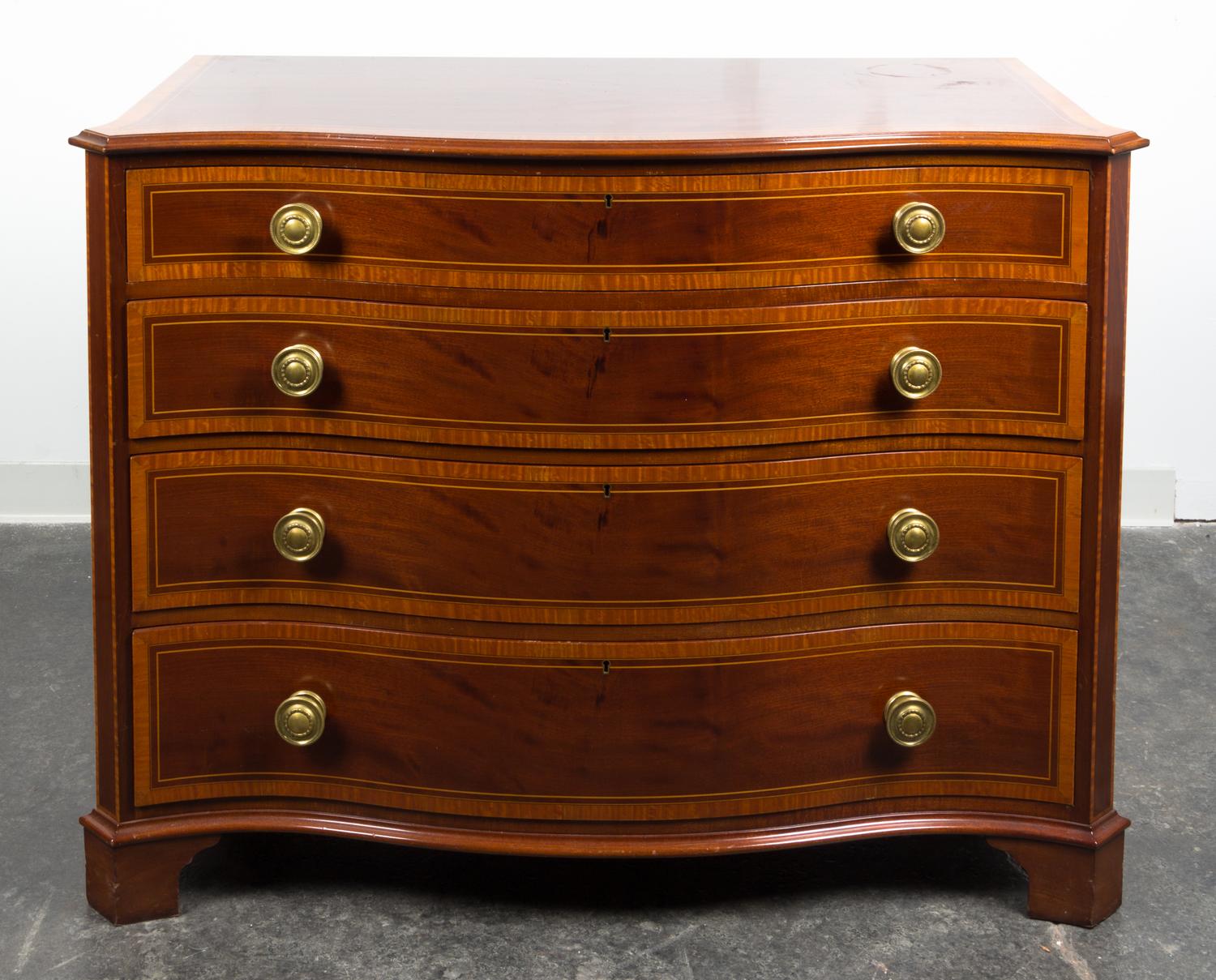 A Regency Style Inlaid Chest of Drawers Height 36 x width 46 x depth 22 1/2 inches.