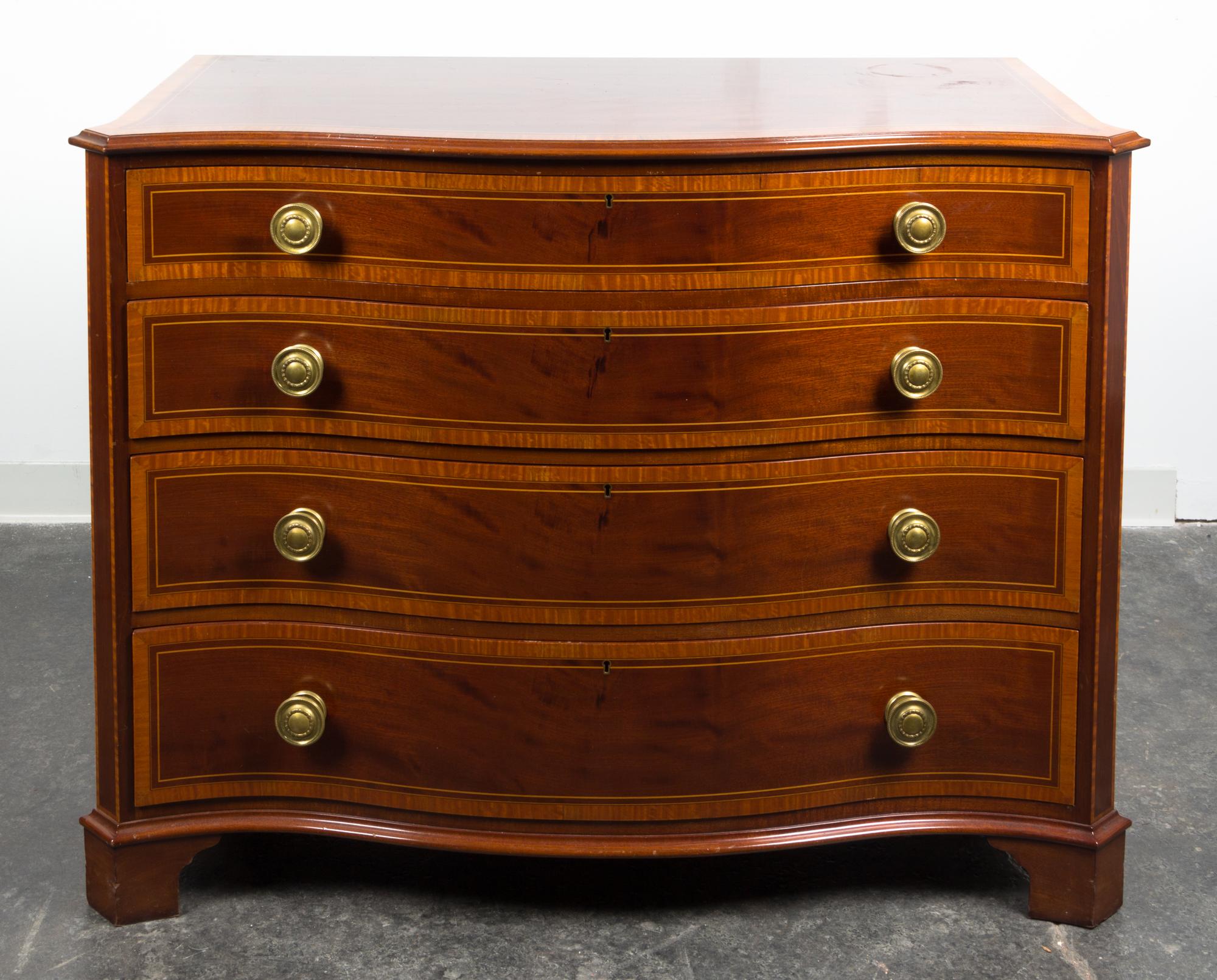 A Regency Style Inlaid Chest of Drawers Height 36 x width 46 x depth 22 1/2 inches.