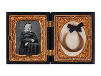 [LINCOLN FAMILY]. Locks of hair purportedly from Abraham Lincoln, Mary Todd Lincoln, and William ("Willie") Lincoln.