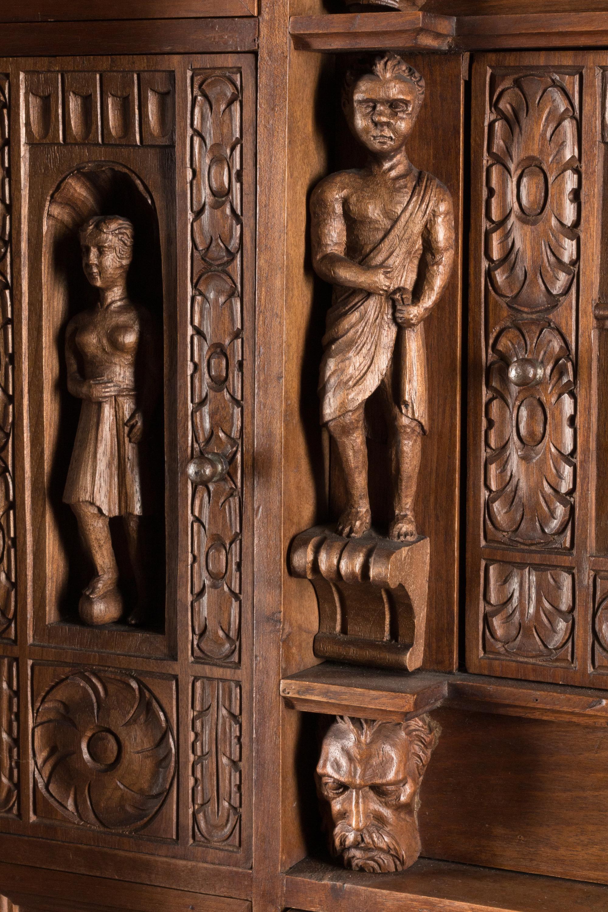 An Italian Renaissance Revival Walnut Cabinet on Stand