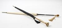Two Gilt-Handled Parasols Length of longer 36 inches.