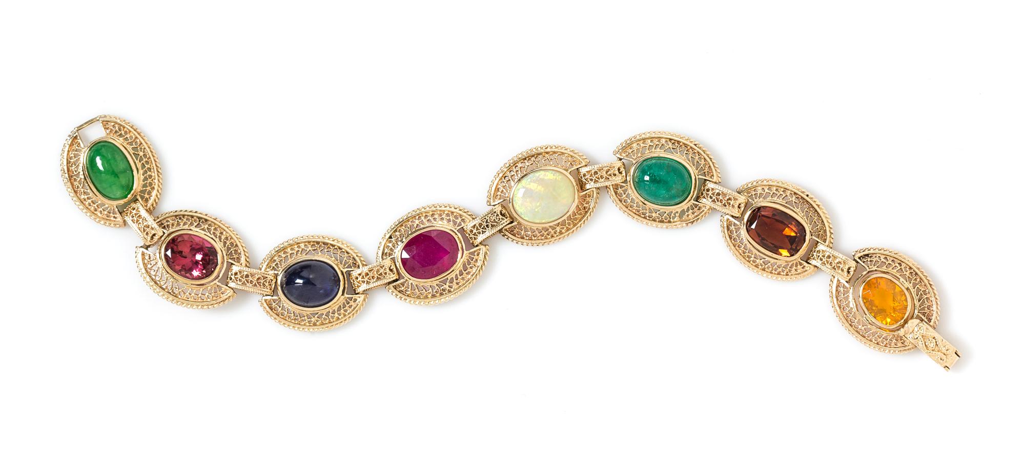 A 14 Karat Yellow Gold and Multigem Bracelet, 17.70 dwts.