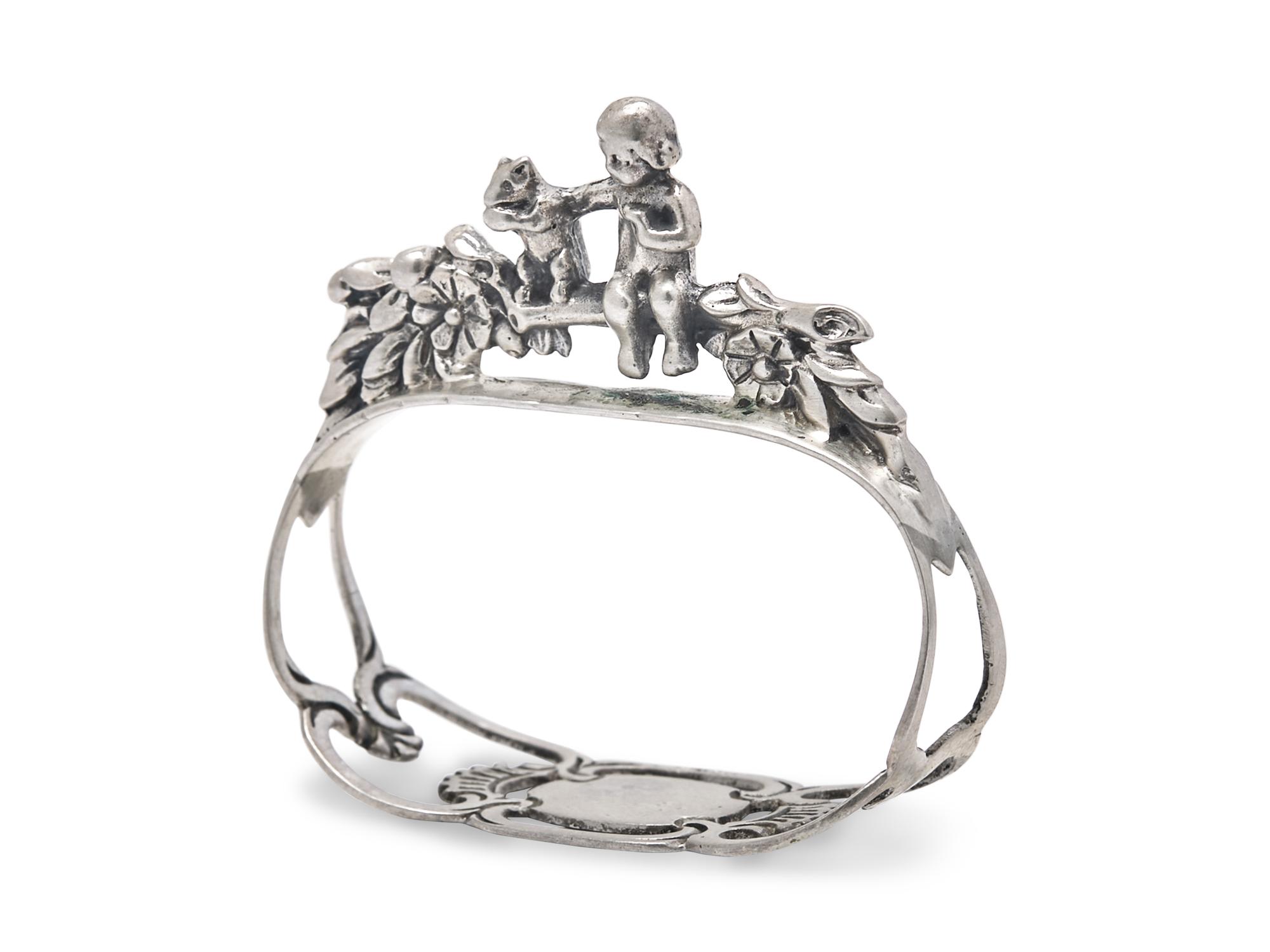A Set of Fifteen German Silver Napkin Rings