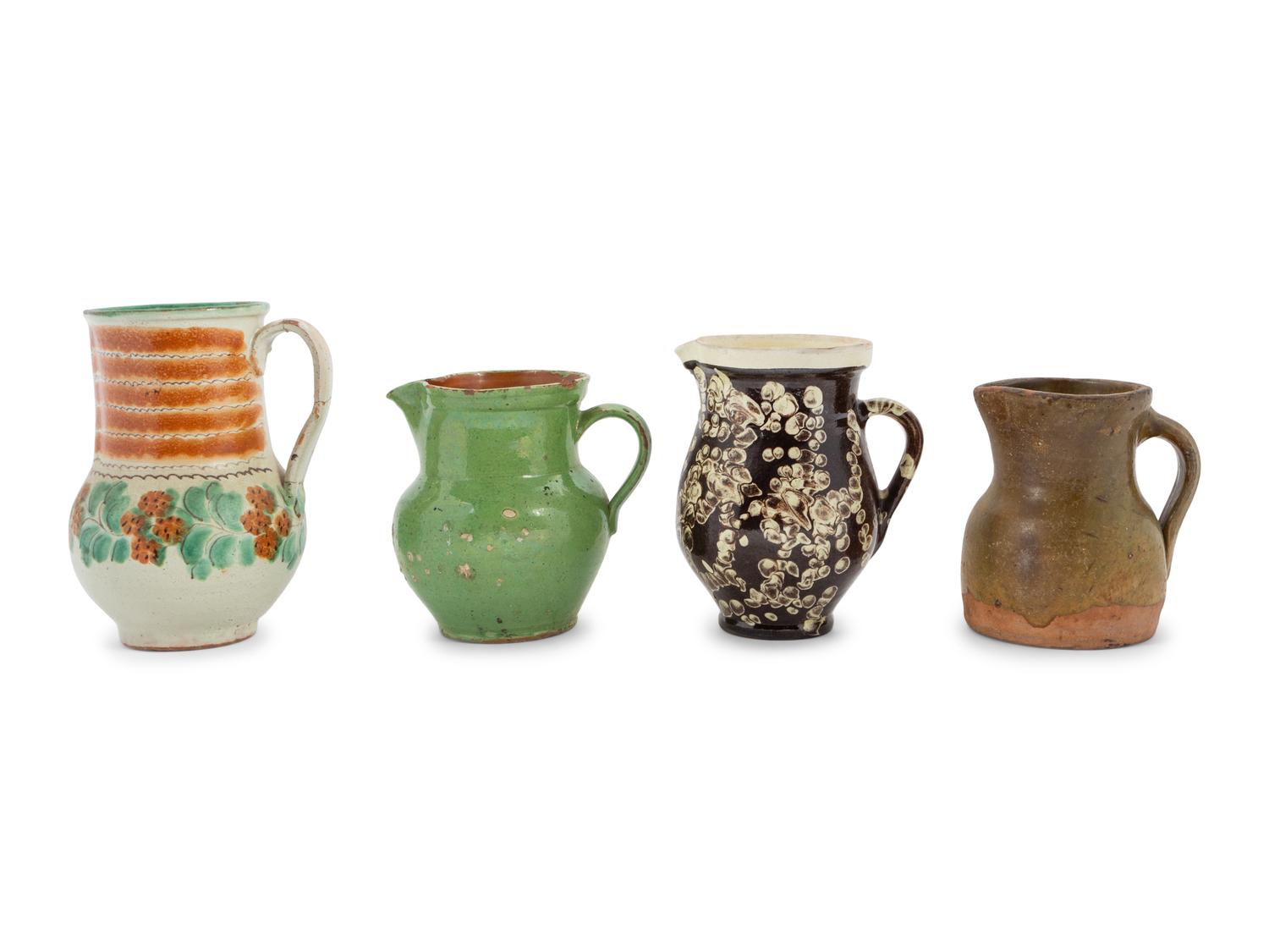 Eight European Pottery Pitchers