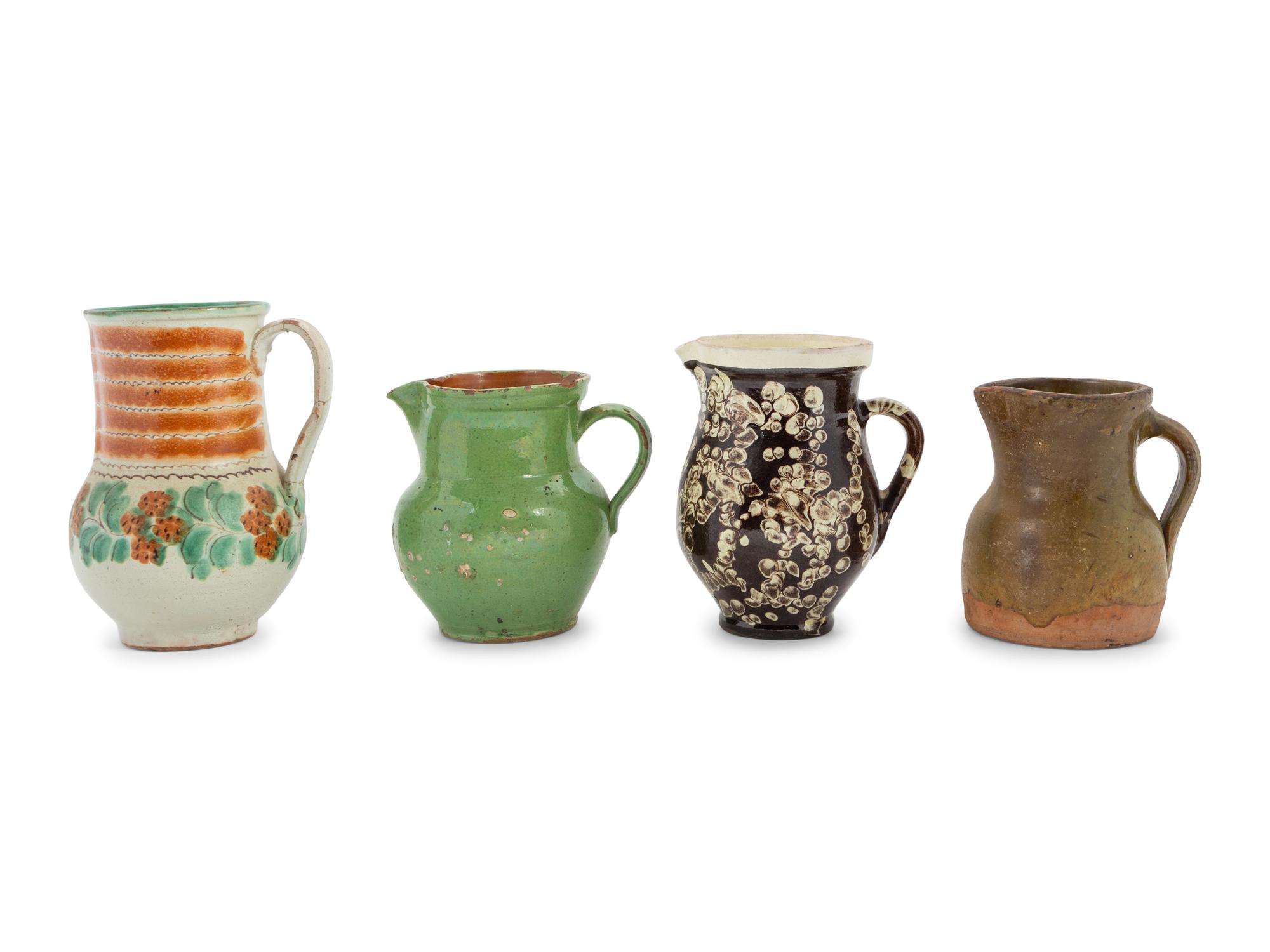 Eight European Pottery Pitchers