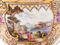 Three Meissen Painted and Parcel Gilt Porcelain Cup and Saucer Sets, a Covered Cup and Two Spoons
