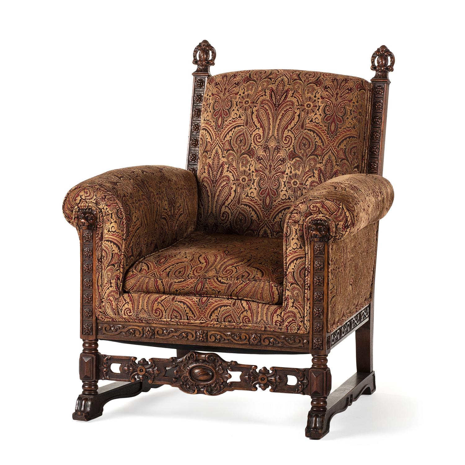 A Jacobean Style Carved Oak Sofa and Armchair