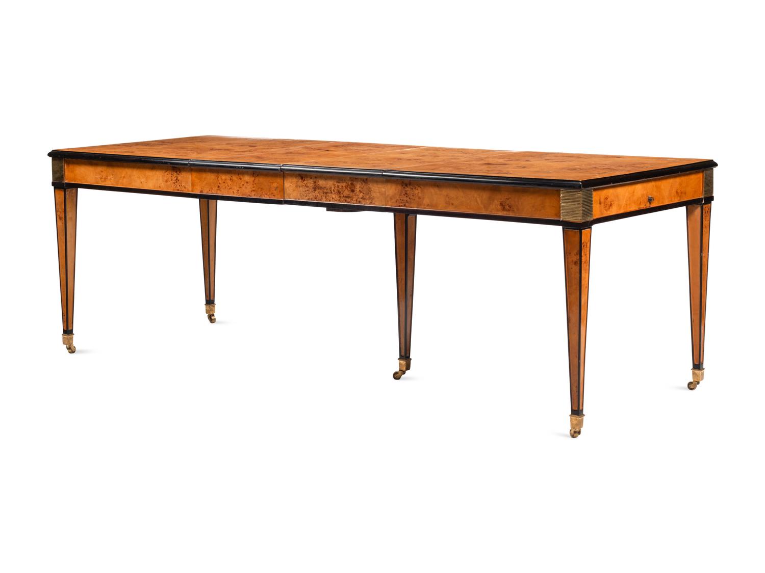 A Biedermeier Style Part Ebonized Burlwood Extending Dining Table