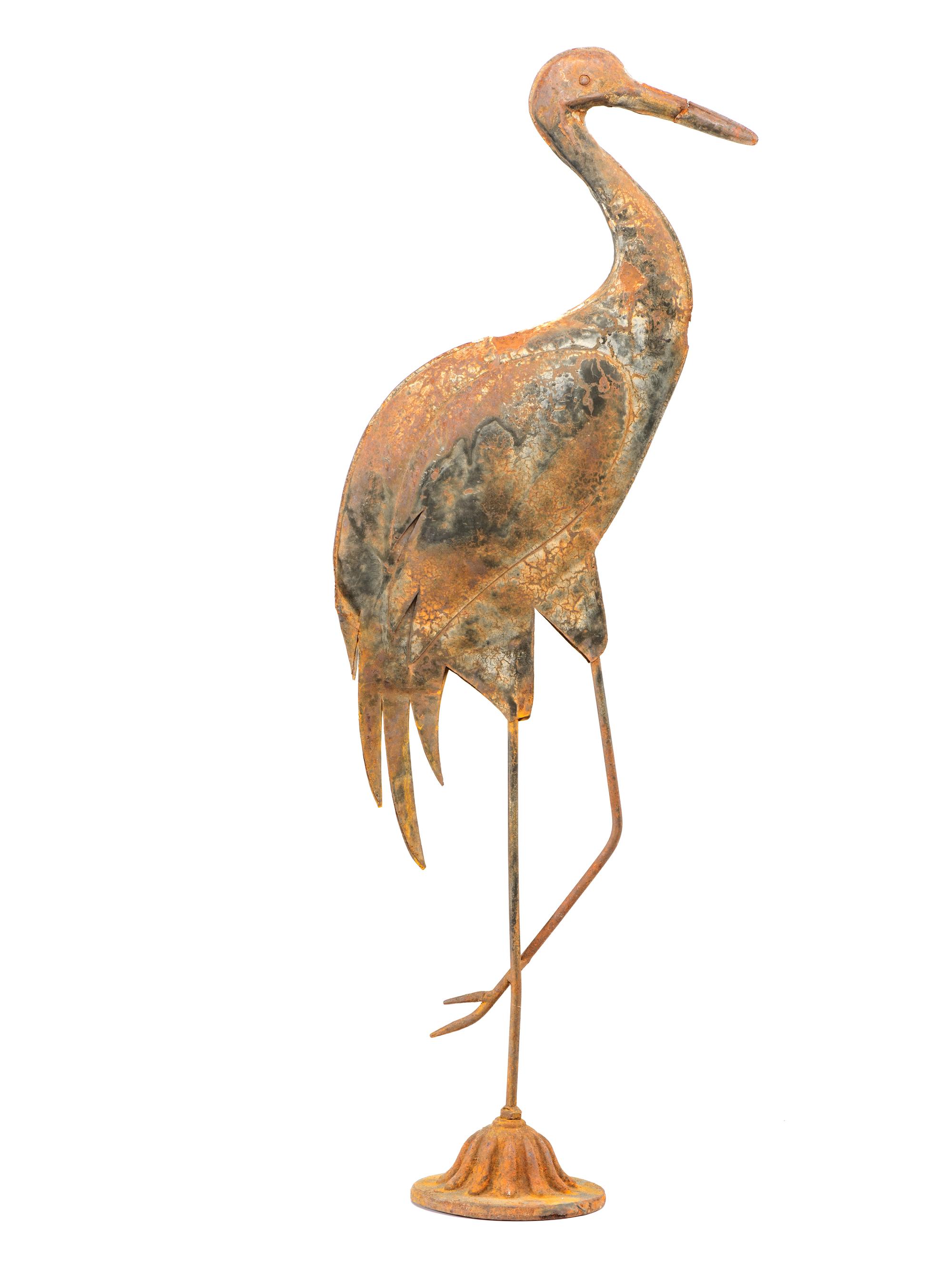 A Cast Iron and Tin Rooster Weathervane and Tin Heron