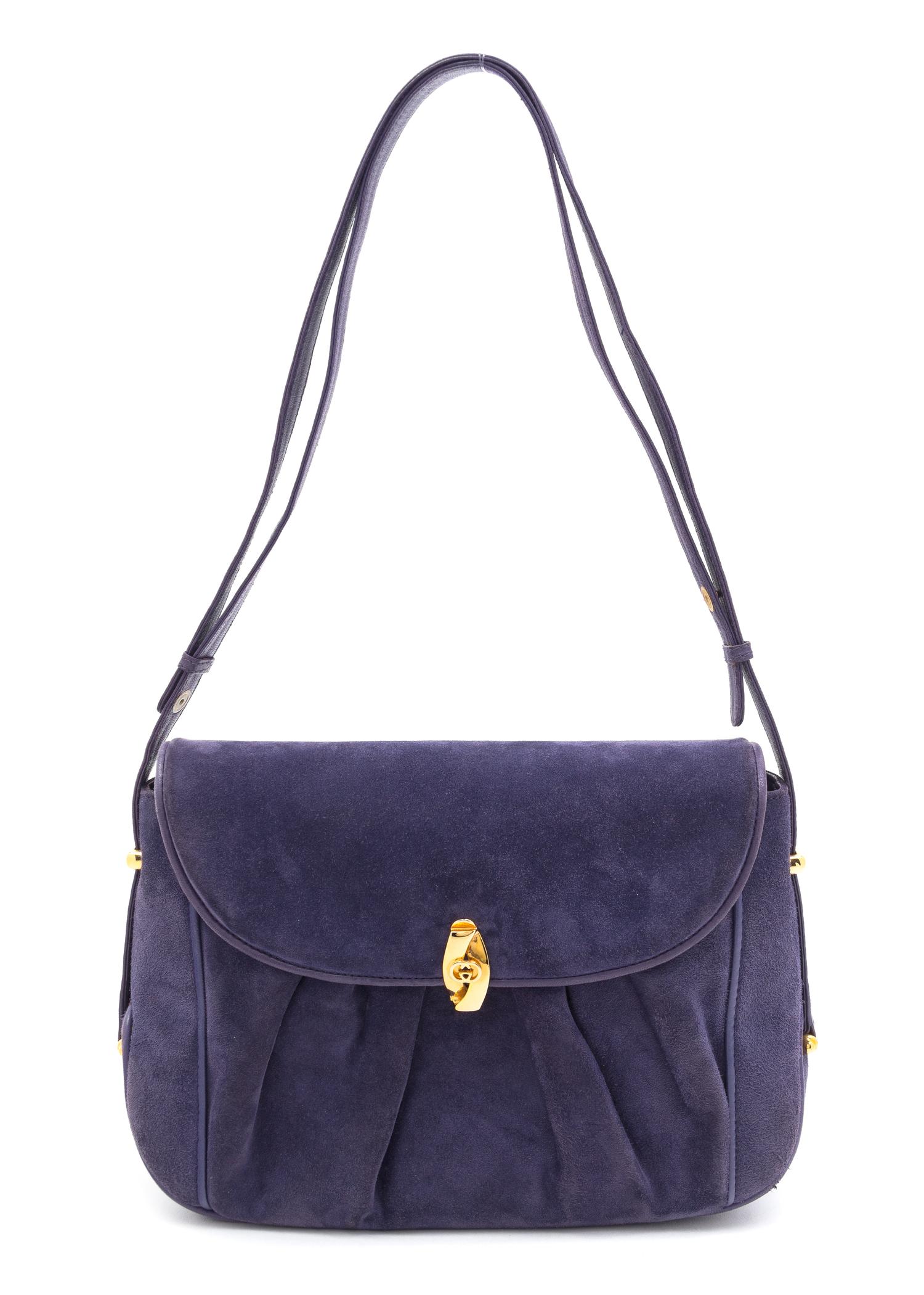 A Gucci Purple Suede Handbag, 9.5" x 7" x 2.5".
