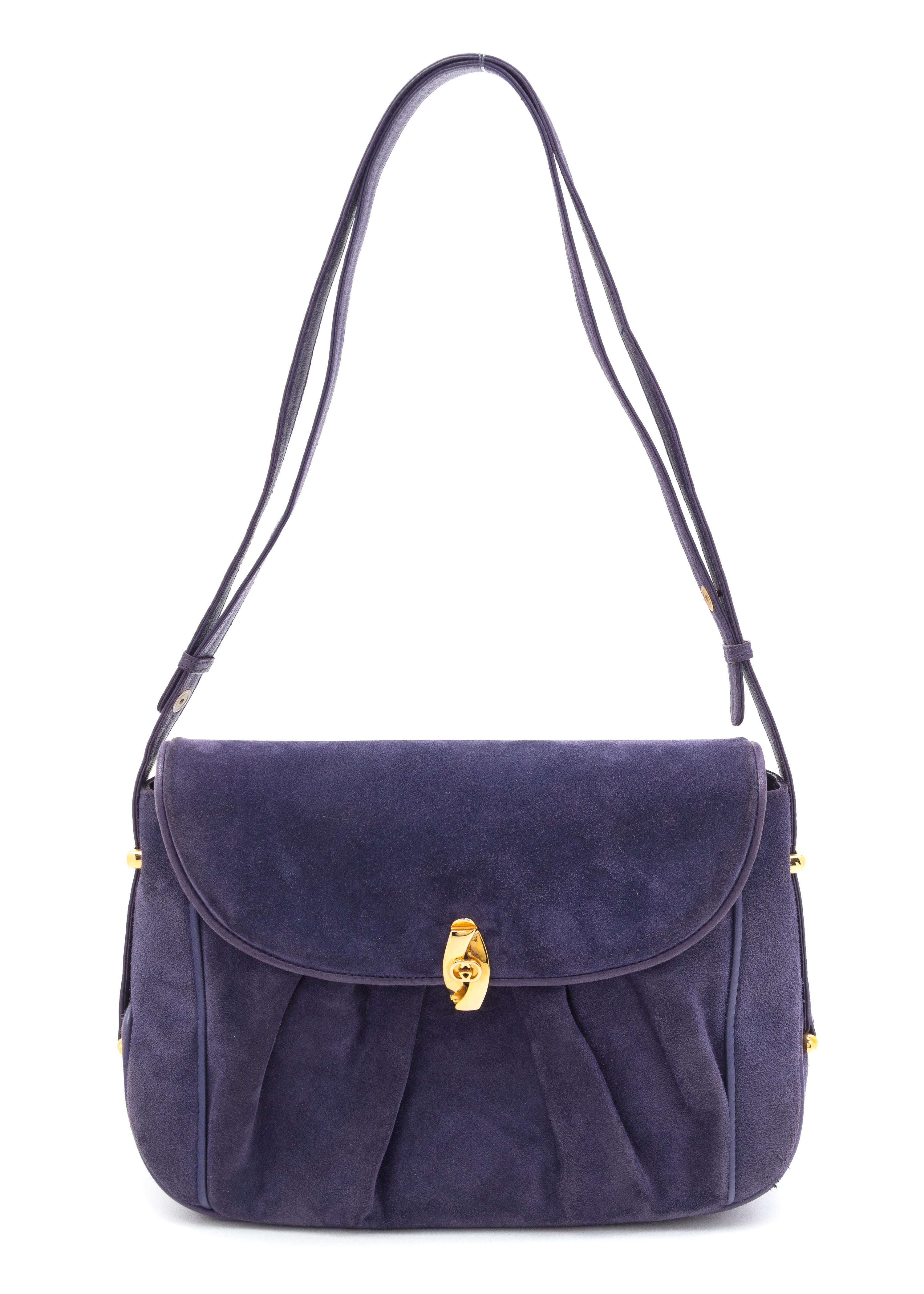 A Gucci Purple Suede Handbag, 9.5" x 7" x 2.5".