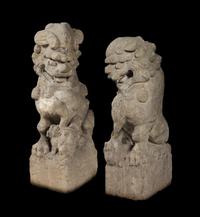 A Pair of Large Carved Stone Figures of Fu Lions