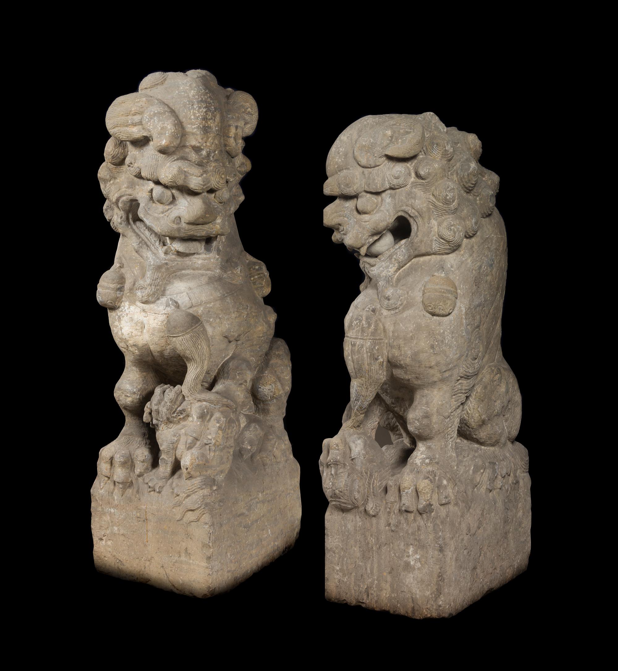 A Pair of Large Carved Stone Figures of Fu Lions