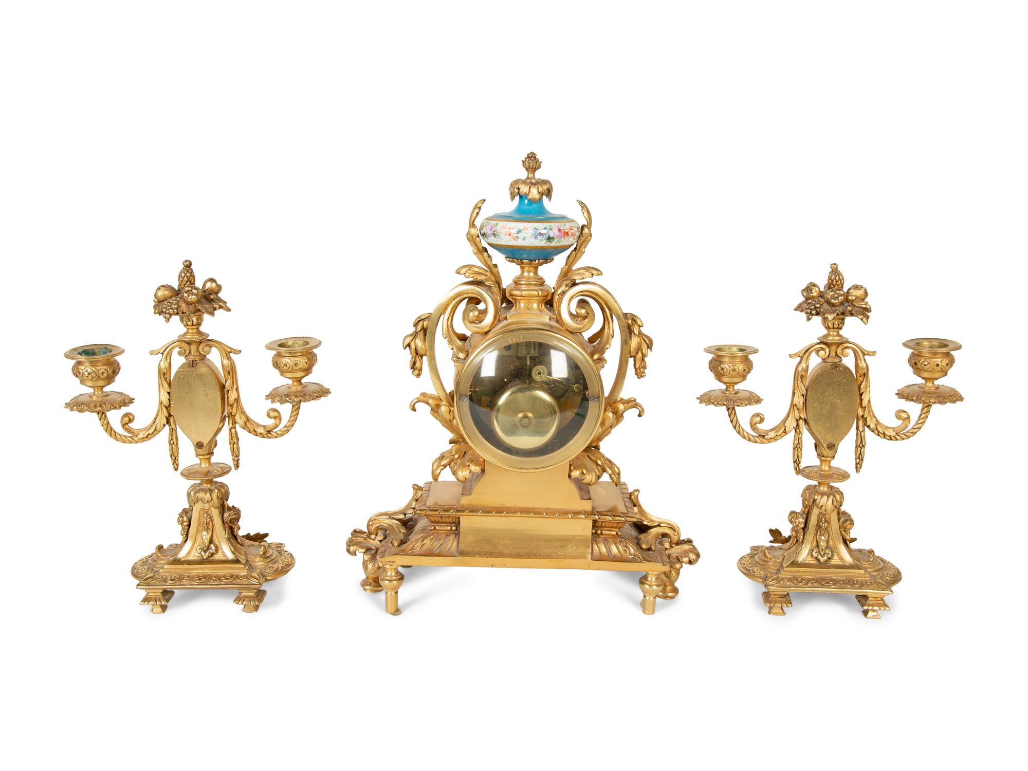 A French Gilt Bronze and Sèvres Porcelain Clock Garniture