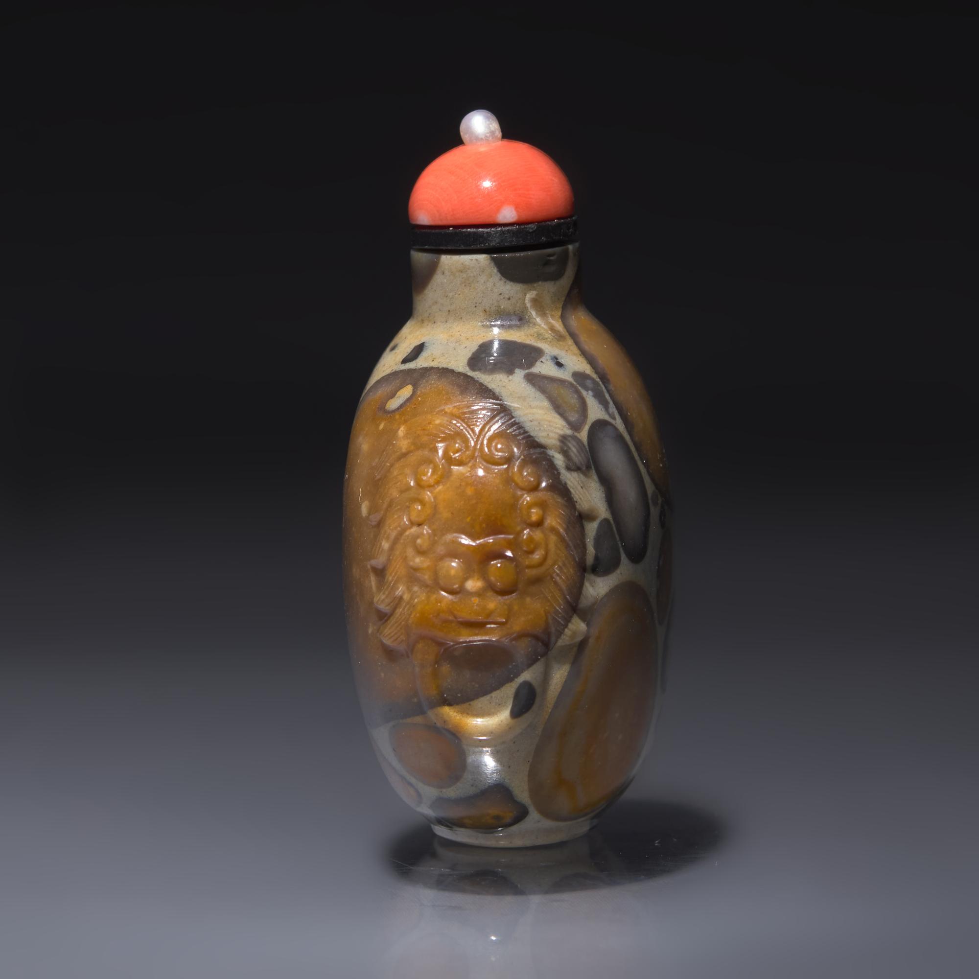 A Chinese Carved Puddingstone Snuff Bottle, Qing Dynasty, Circa 1750-1820 — 1750-1820年 抱子石鋪首啣環耳鼻煙壺