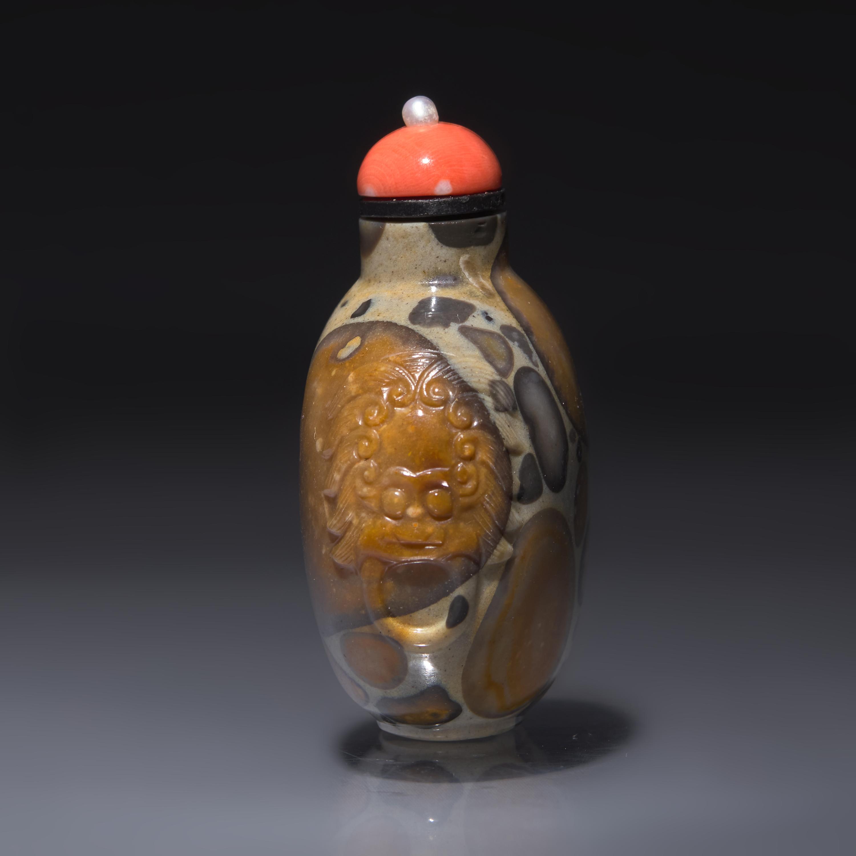 A Chinese Carved Puddingstone Snuff Bottle, Qing Dynasty, Circa 1750-1820 — 1750-1820年 抱子石鋪首啣環耳鼻煙壺