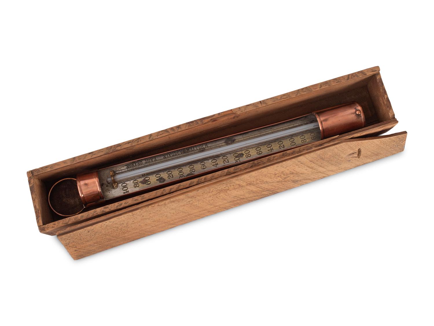 A Copper Tycos Candy Thermometer and a Wood Encased Floating Bath or Dairy Thermometer