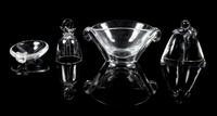 Steuben, a group of four table articles, comprising a bell, hugging figure, handled dish, and handled bowl