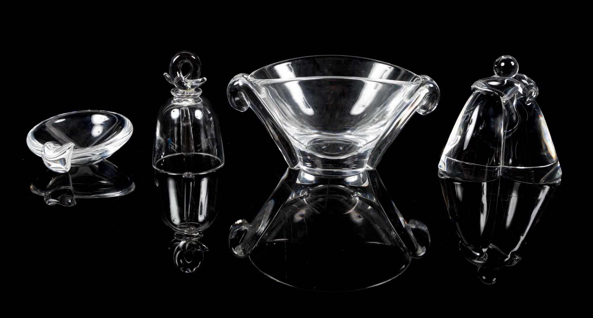 Steuben, a group of four table articles, comprising a bell, hugging figure, handled dish, and handled bowl