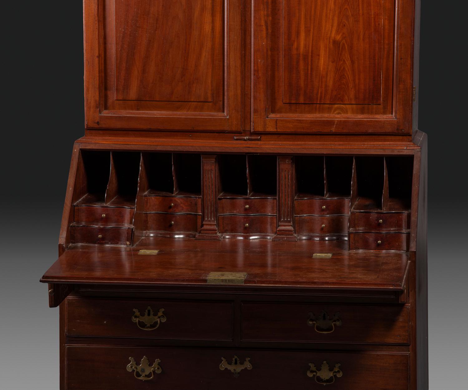 A Chippendale Figured Mahogany Bonnet Top Desk-and-Bookcase