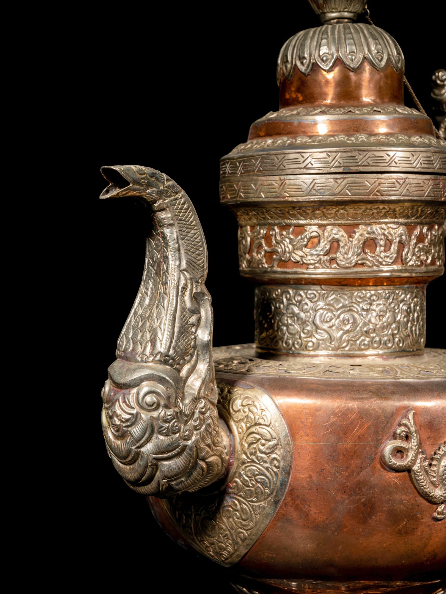 A Tibetan Silver and Copper Covered Ewer and A Chinese Bronze Pitcher