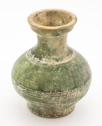 A Green Glazed Pottery Vase Height 7 inches.