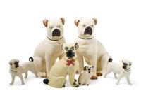 A Group of Glazed Ceramic Pug Figures