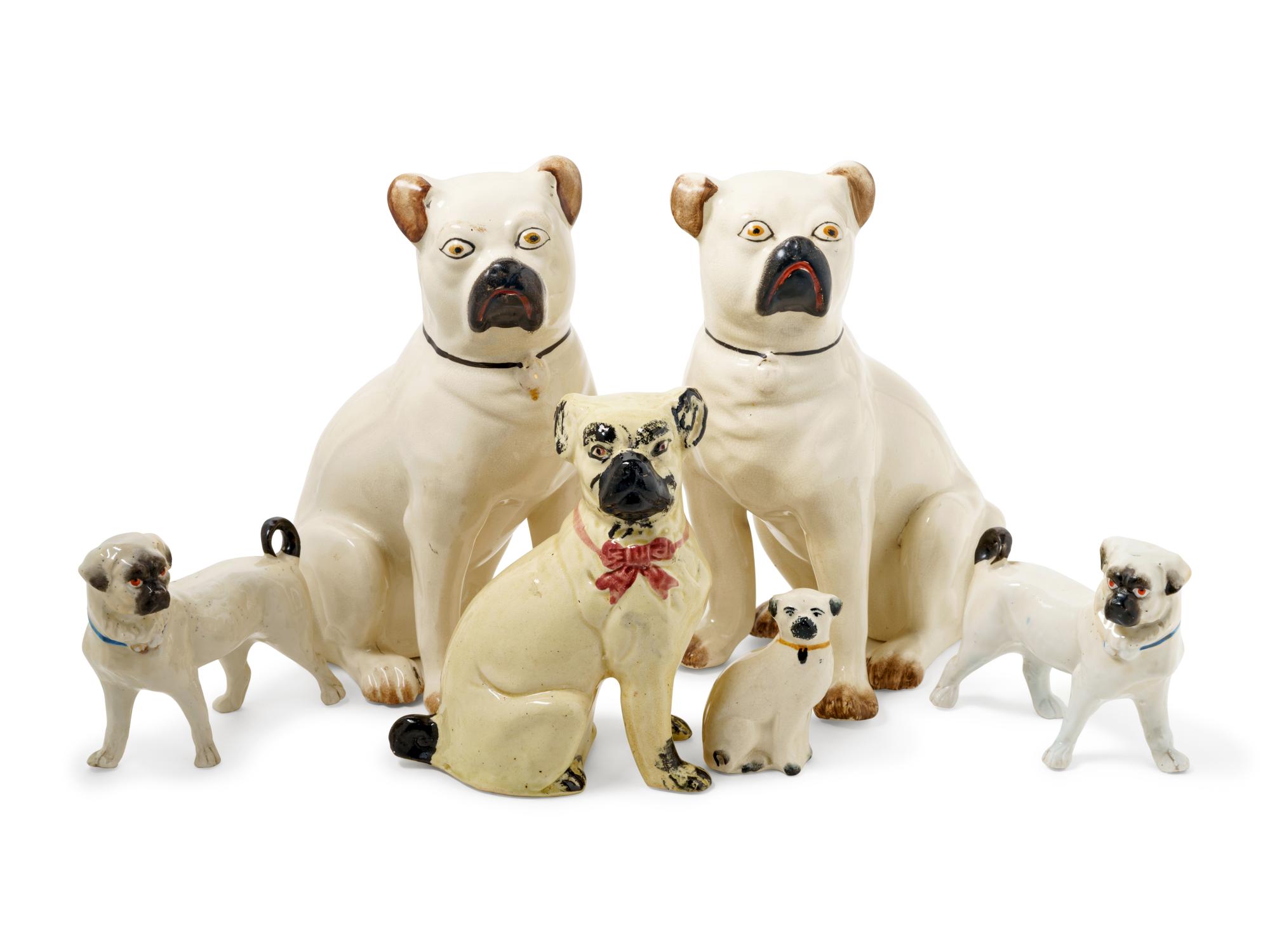 A Group of Glazed Ceramic Pug Figures