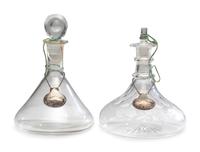 Fifteen Glass Decanters with English Shell-Form Silver Bottle Tags