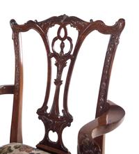 A Set of Twelve George II Style Carved Mahogany Dining Chairs
