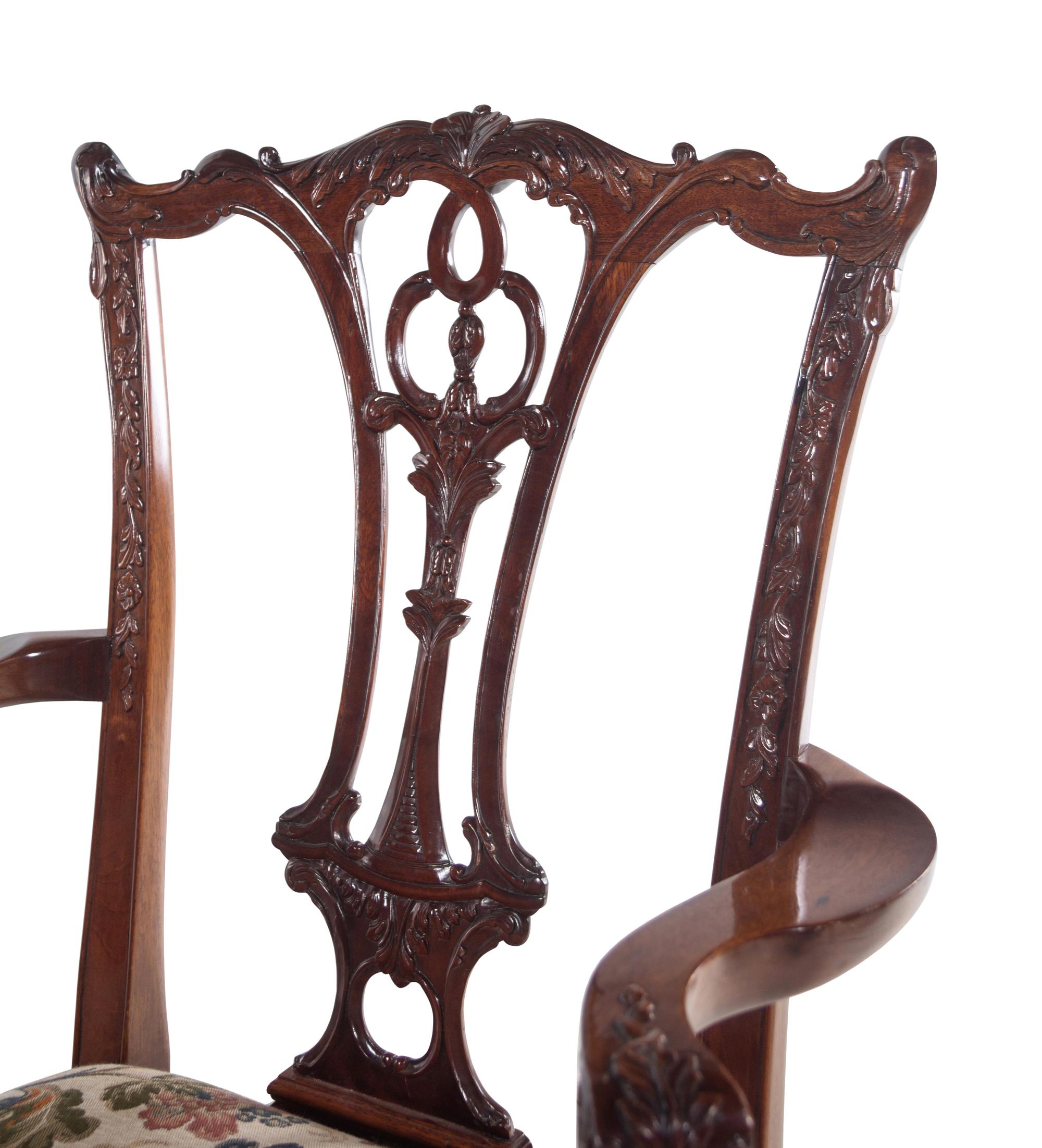 A Set of Twelve George II Style Carved Mahogany Dining Chairs