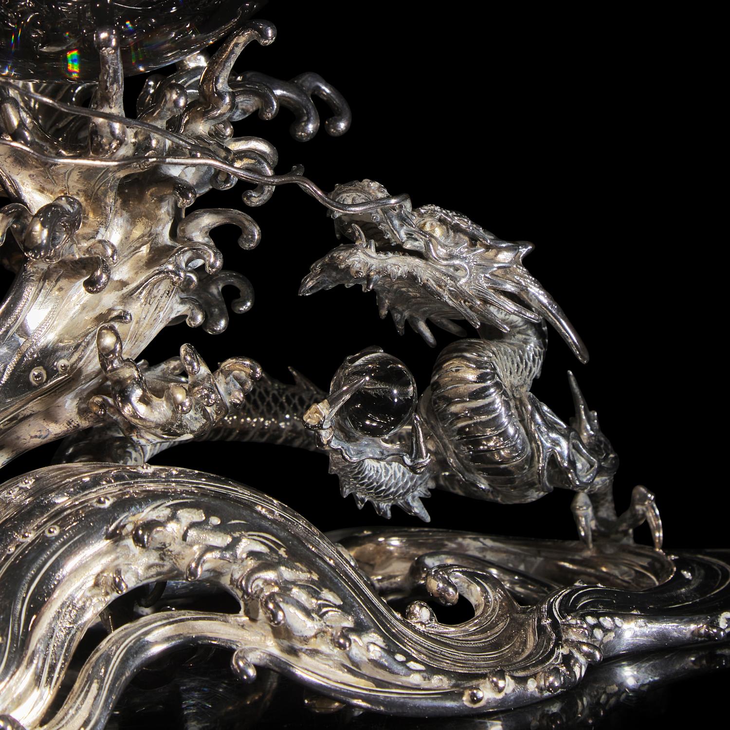 A Japanese Rock Crystal Sphere and Silver 'Dragon and Waves' Stand, Signed Yoshimasa Saku Meiji/Taisho Period 日本明治/大正時期 義正作潮を支配する珠と龍