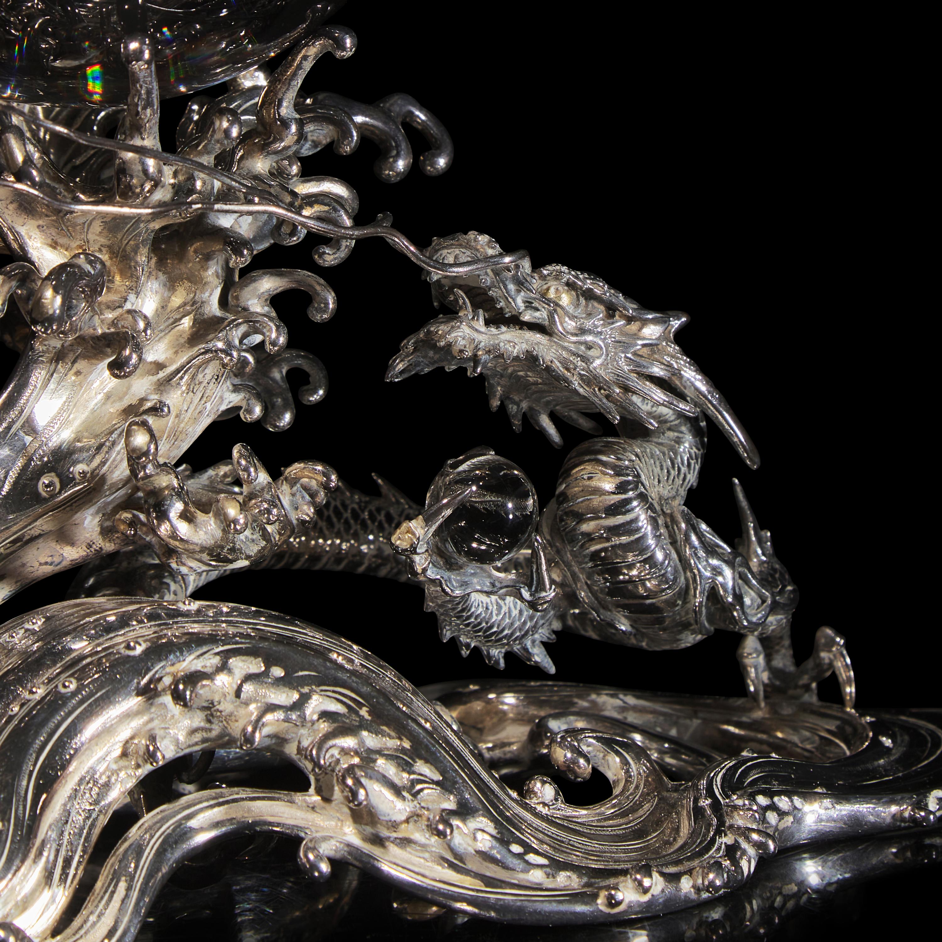 A Japanese Rock Crystal Sphere and Silver 'Dragon and Waves' Stand, Signed Yoshimasa Saku Meiji/Taisho Period 日本明治/大正時期 義正作潮を支配する珠と龍