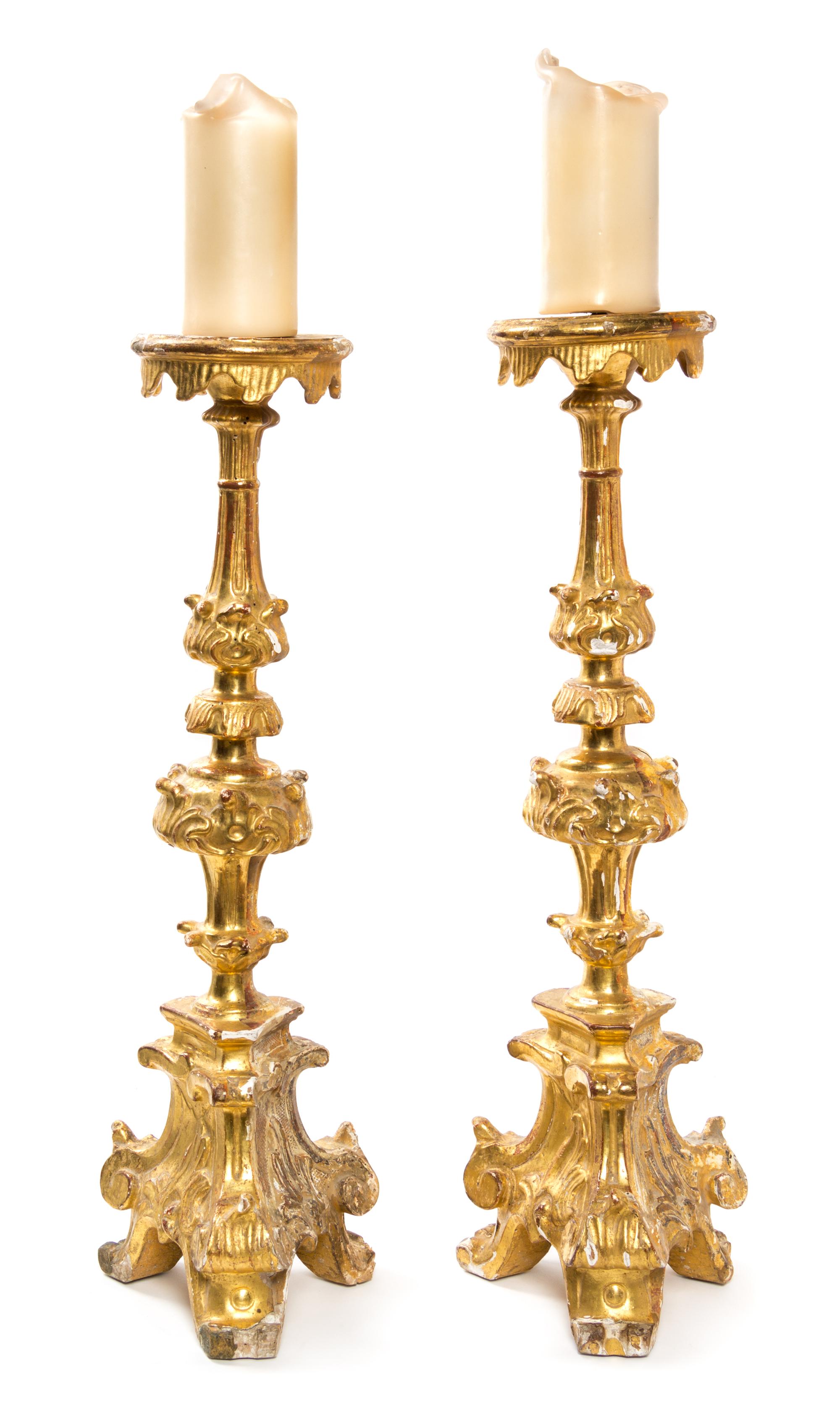 A Pair of Italian Giltwood Prickets Height 24 7/8 inches.