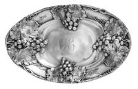 An American Silver Bowl, Mauser Mfg. Co., New York, NY, of oval form, the rim worked to show grape cluster and vine decoration, centere