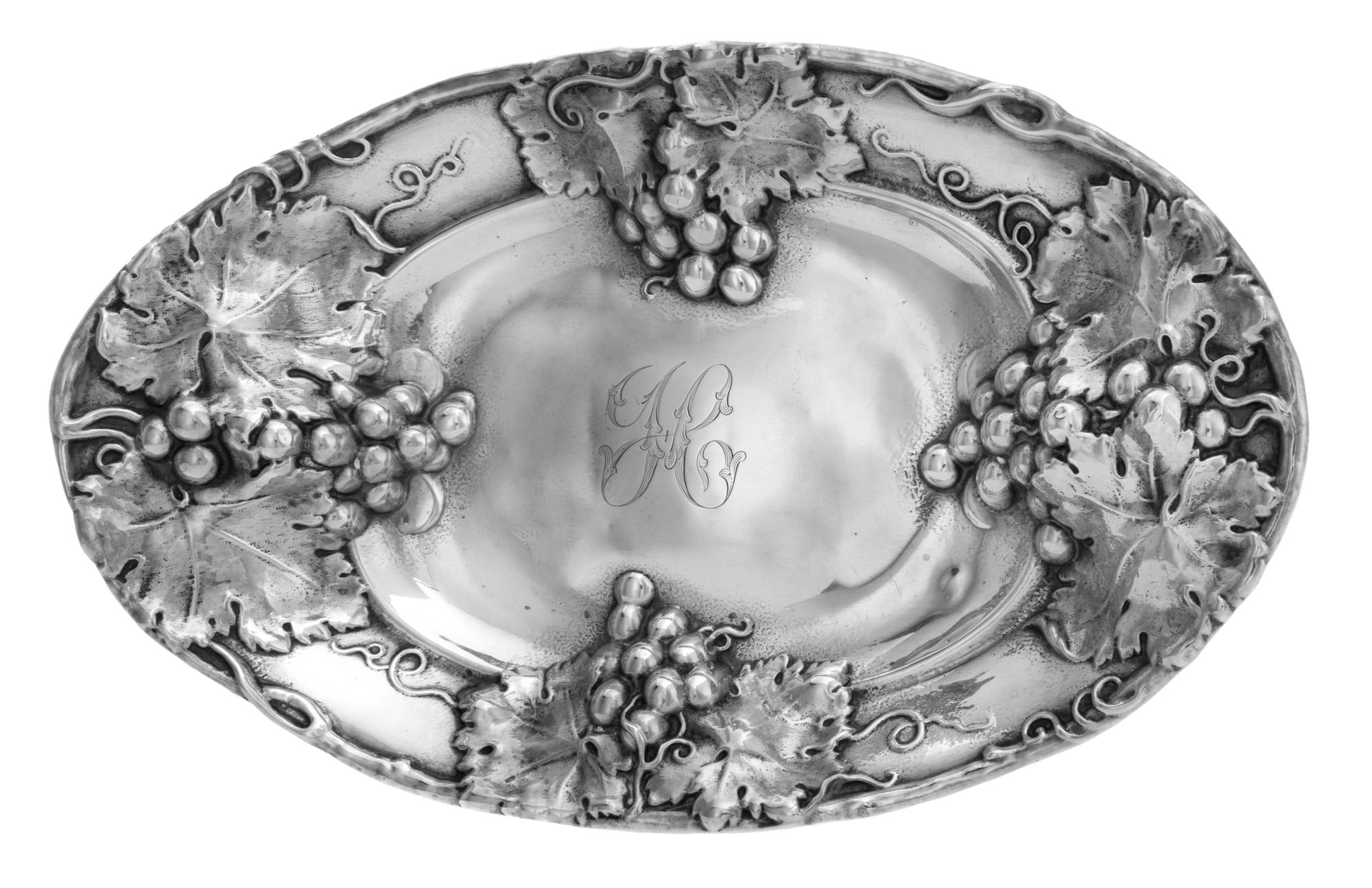 An American Silver Bowl, Mauser Mfg. Co., New York, NY, of oval form, the rim worked to show grape cluster and vine decoration, centere