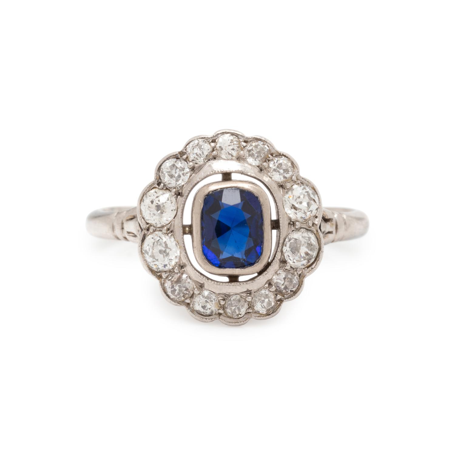 PLATINUM, SAPPHIRE AND DIAMOND RING