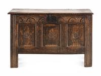 A Charles II Carved Oak Plank Chest