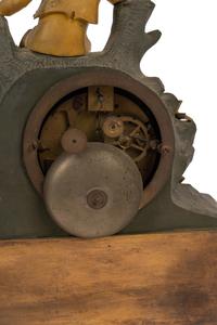 A Charles X Gilt and Patinated Bronze Figural Mantel Clock
