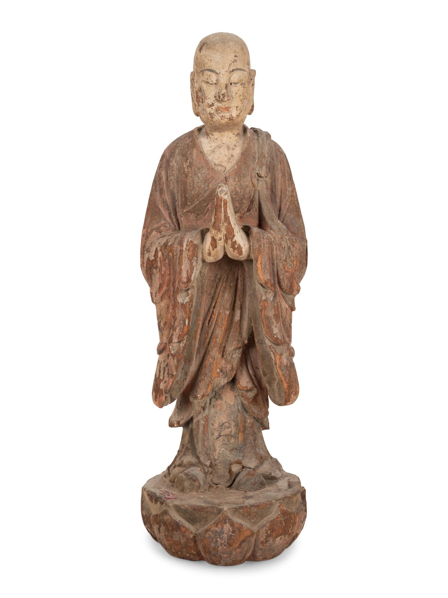 A Chinese Carved Wood Standing Figure with Polychrome Decoration