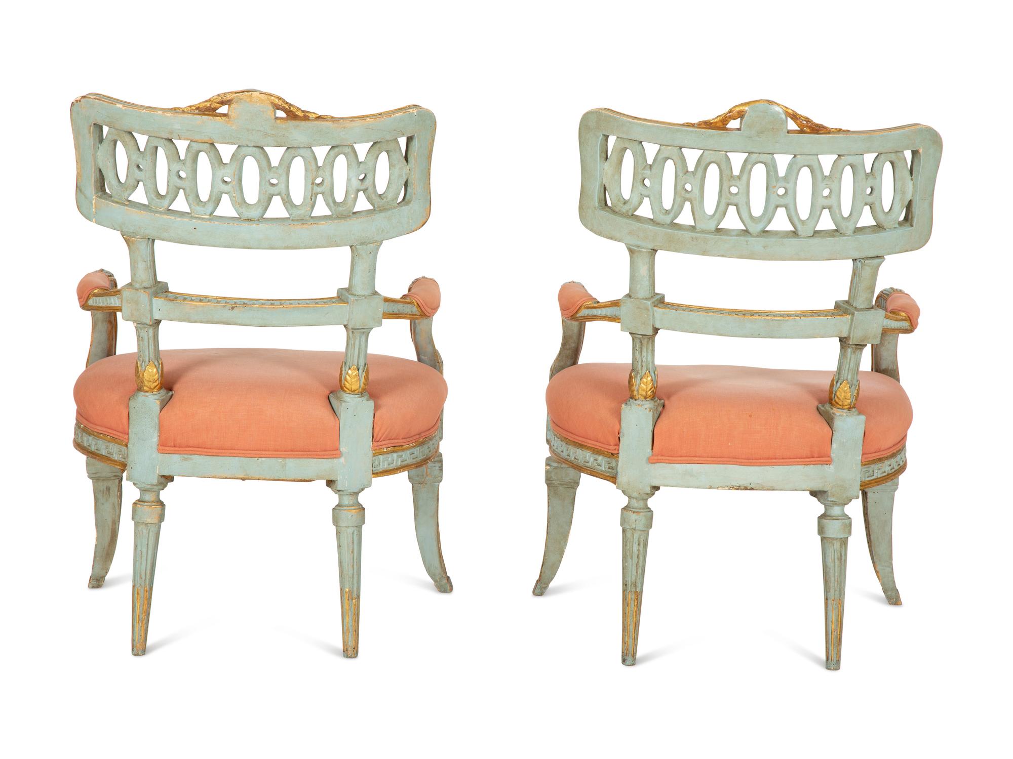 A Pair of Venetian Painted and Parcel Gilt Armchairs