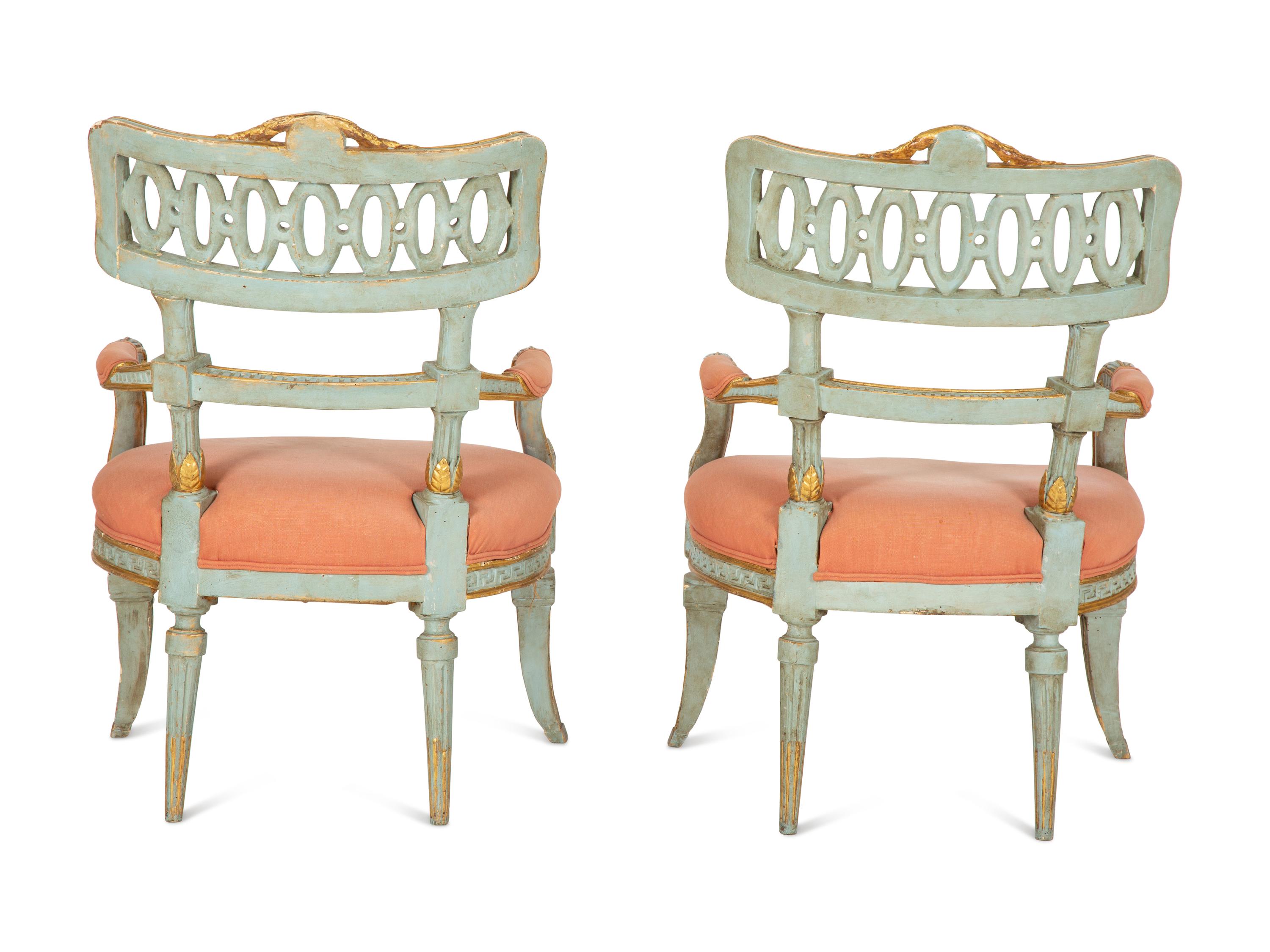 A Pair of Venetian Painted and Parcel Gilt Armchairs