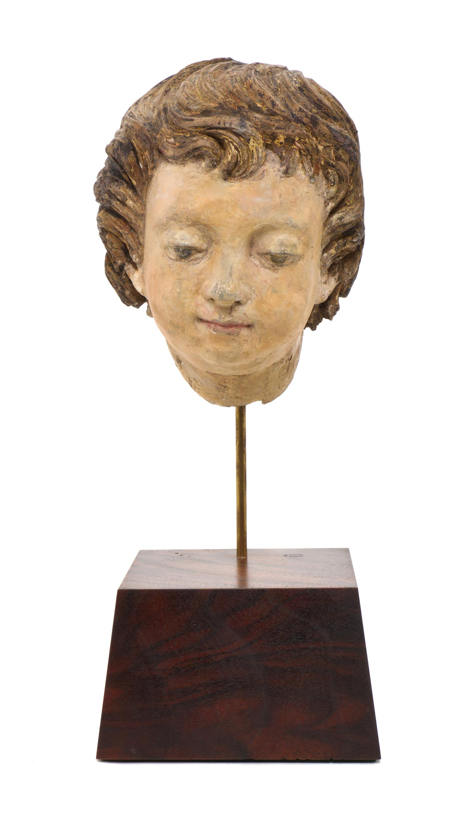 An Italian Carved Head of a Boy, POSSIBLY 15TH/16TH CENTURY WITH ALTERATION, Height of head 8 inches. — POSSIBLY 15TH/16TH CENTURY WITH ALTERATION,