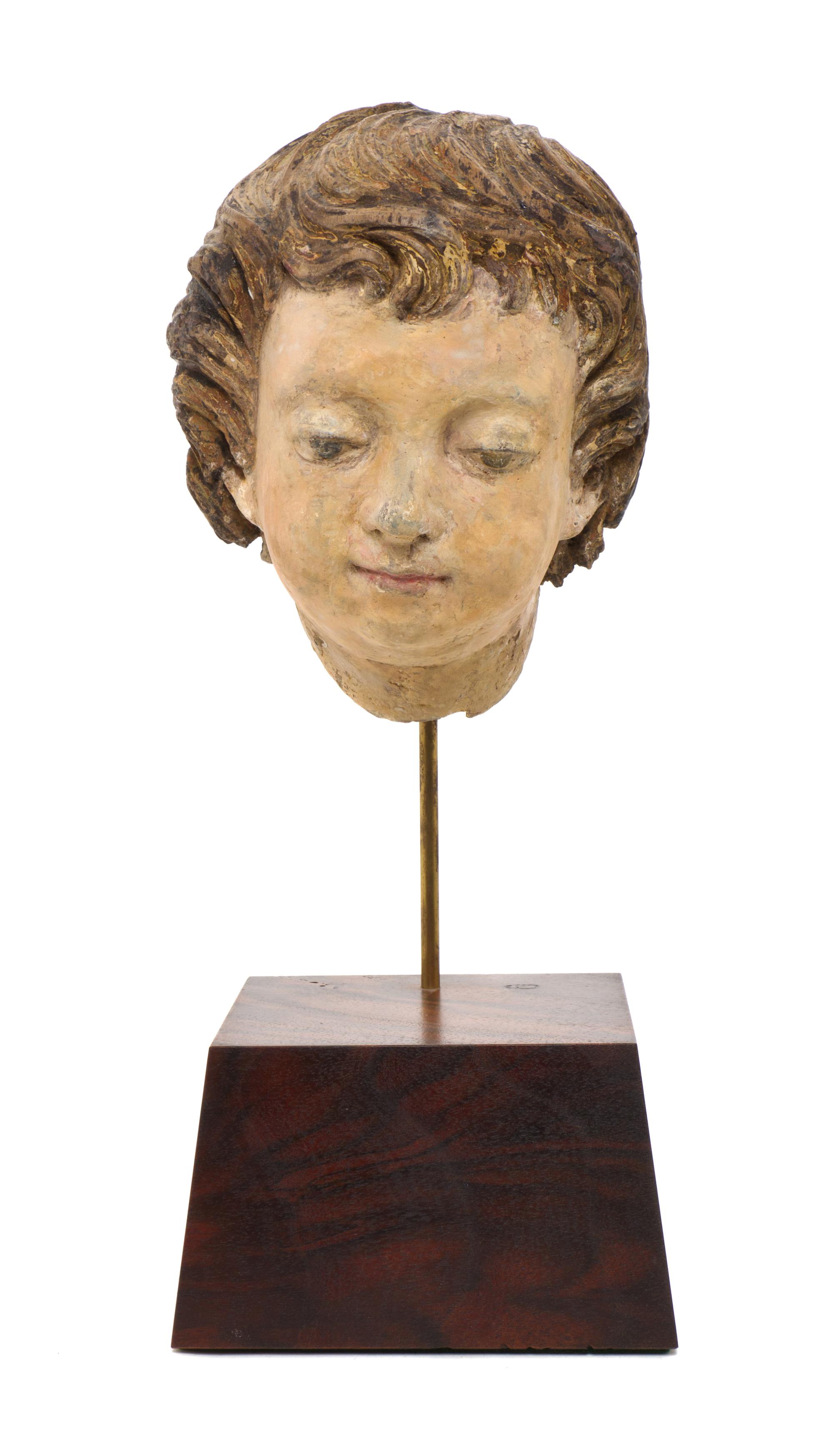 An Italian Carved Head of a Boy, POSSIBLY 15TH/16TH CENTURY WITH ALTERATION, Height of head 8 inches. — POSSIBLY 15TH/16TH CENTURY WITH ALTERATION,