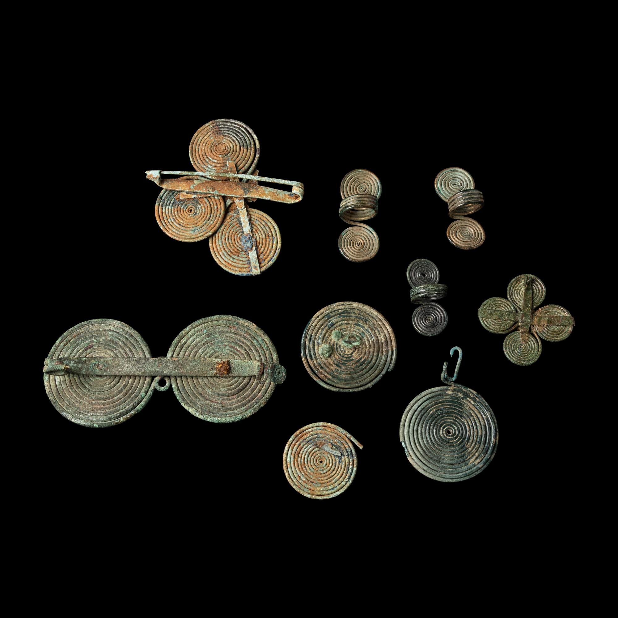 Nine European Bronze Age Spectacle Rings and Fibulae Fragments
