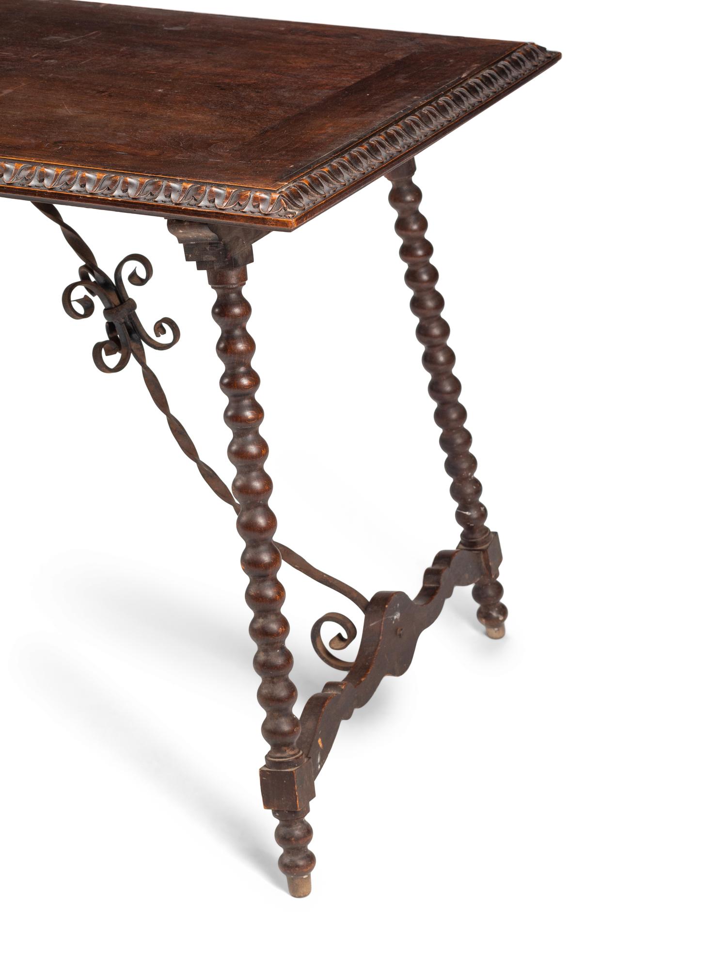 A Renaissance Style Iron Mounted Walnut Table