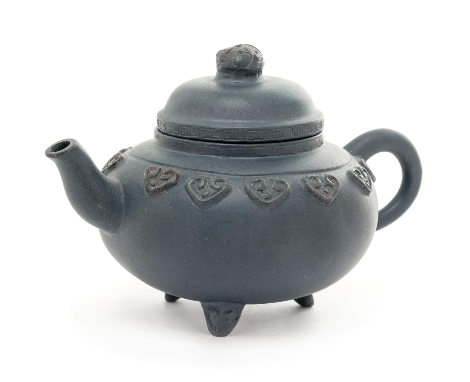 A Yixing Pottery Teapot Height 3 1/4 inches.