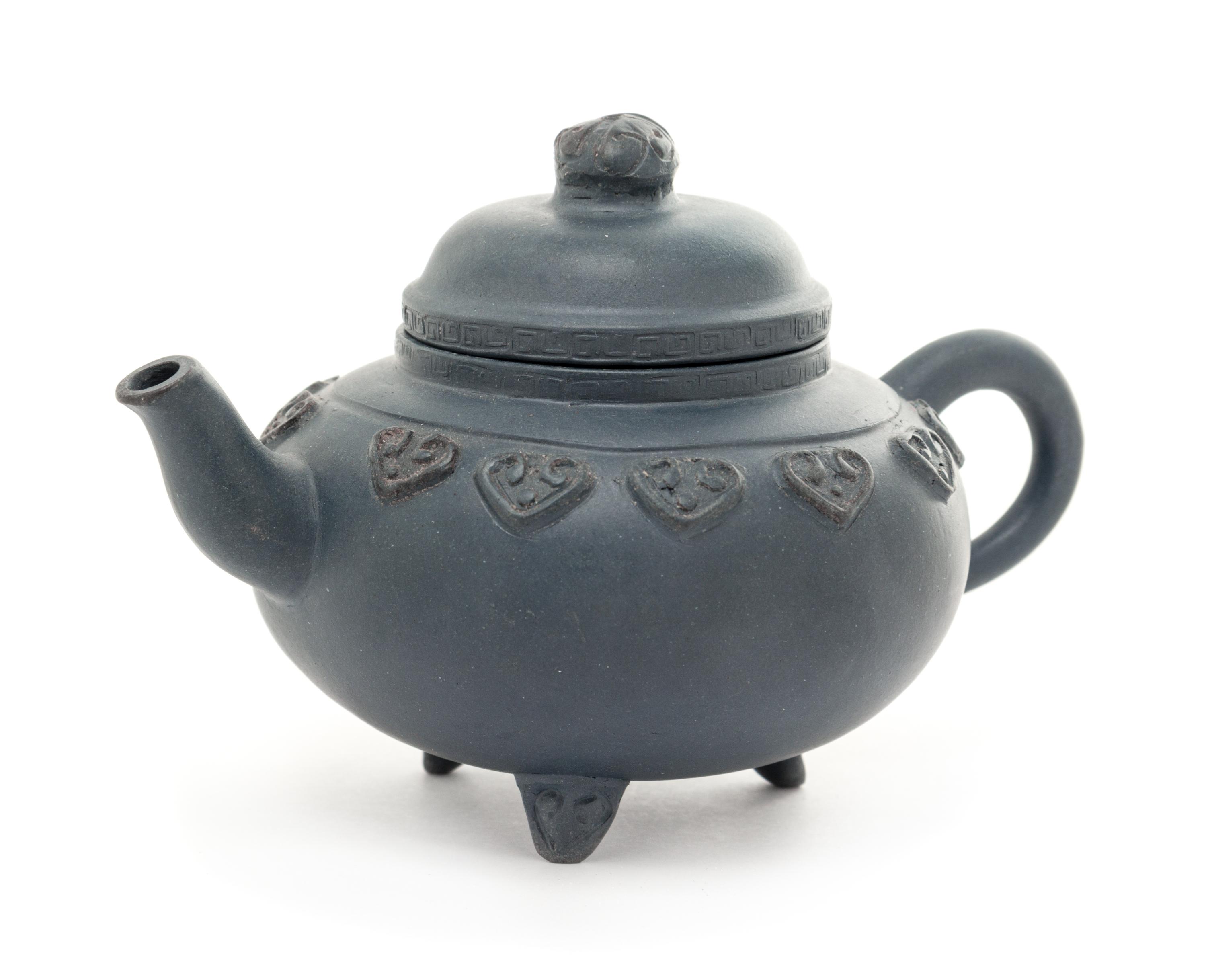 A Yixing Pottery Teapot Height 3 1/4 inches.